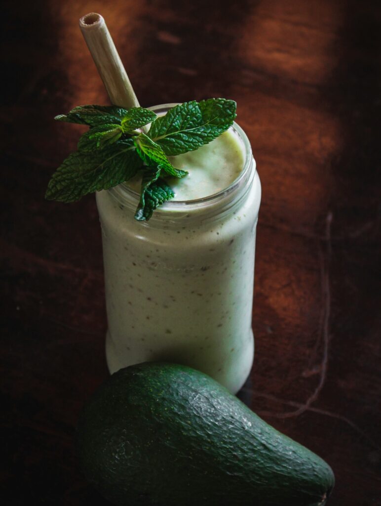 Smoothie with whole avocado and mint topping