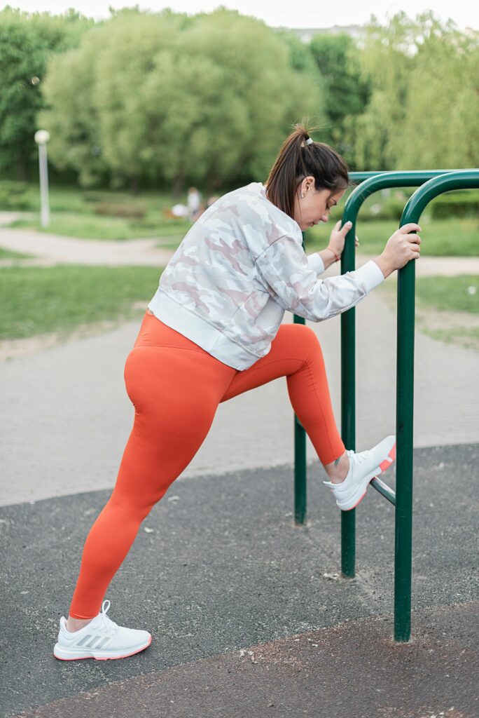 woman stretching to slim down after 30